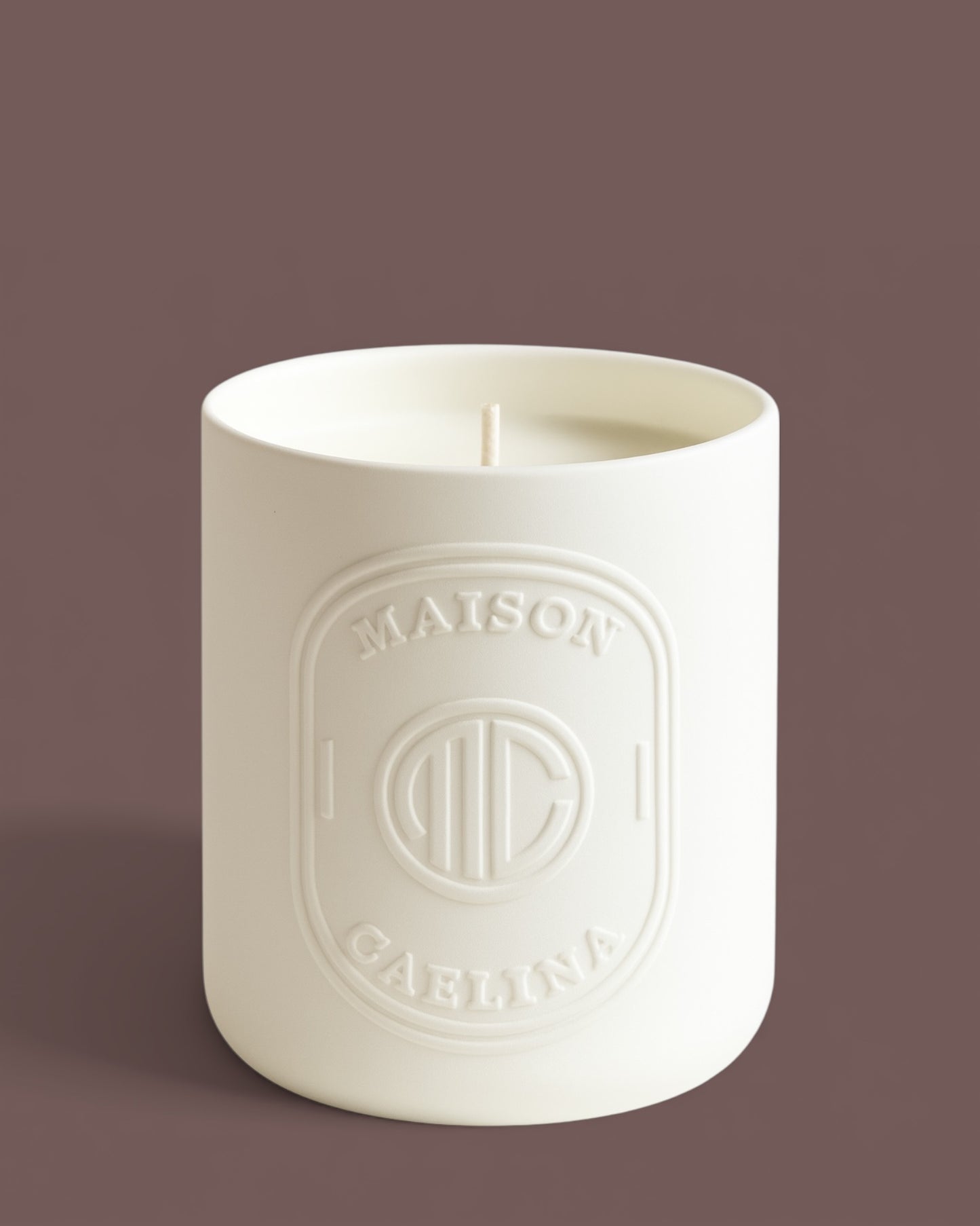 Rose and oud soy wax candle in white ceramic vessel by Maison Caelina