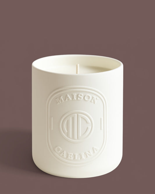 Rose and oud soy wax candle in white ceramic vessel by Maison Caelina