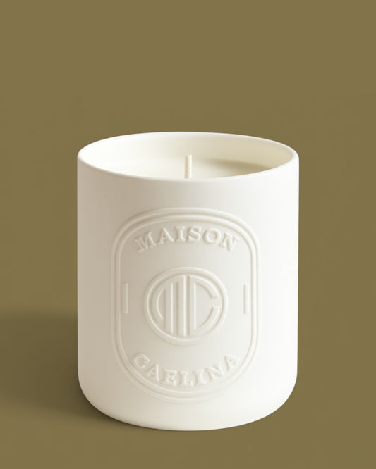 Golden santal neroli soy wax candle in white ceramic vessel by Maison Caelina